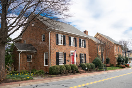 House facades in ancient American city in Virginia with traditional architecture. Ancient brick...