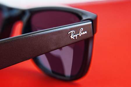 close-up of the Ray-Ban brand logo on black Ray Ban sunglasses with plastic frames.のeditorial素材
