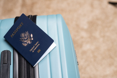 US citizen passport lies on baggage for travel.の写真素材