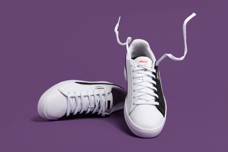 Sports white and black sneakers from Puma with white laces.のeditorial素材