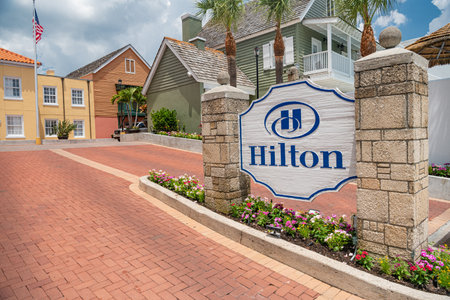 hilton hotel logo. on a stone gate in St. Augustine USA. hospitality company with representative offices in different countriesのeditorial素材