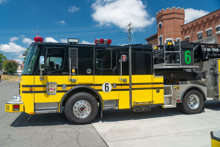 fire trucks garage: with spacious bays, bright emergency lights, tools lined up, readiness for...