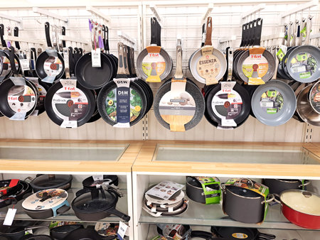 Arrangement of goods on shelves in a supermarket. Pans and pots on display.のeditorial素材