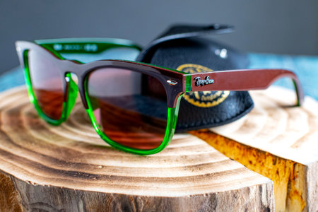 Ray Ban sunglasses and leather glasses case with brand logo.のeditorial素材