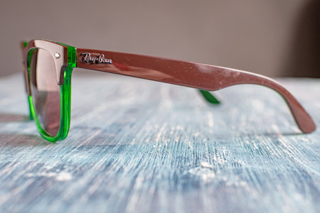 Ray-Ban sunglasses in green plastic frame. Popular and fashionable accessoryのeditorial素材