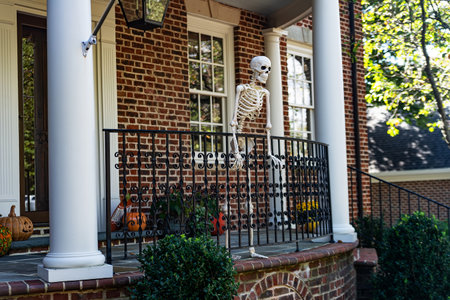 Skeletons in front of the front door are traditional Halloween decorations in America.