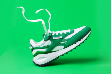 sports green reebok sneakers on a green background,のeditorial素材