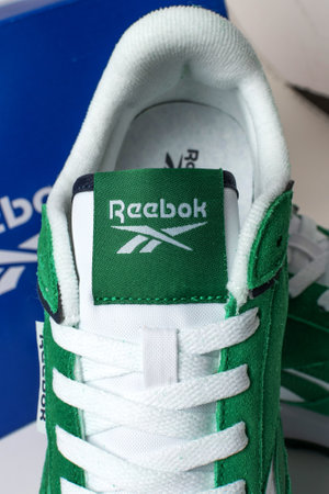 sports green reebok sneakers on a green background,のeditorial素材