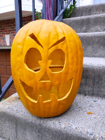 Pumpkins for Halloween on the steps of the entrance to the house.の写真素材