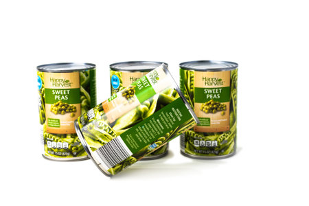 Canned sweet peas in cans on white backgroundのeditorial素材
