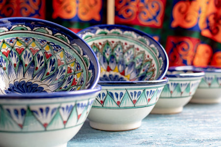 Oriental traditional Ceramic Pyals with national ornaments in Asian market.
