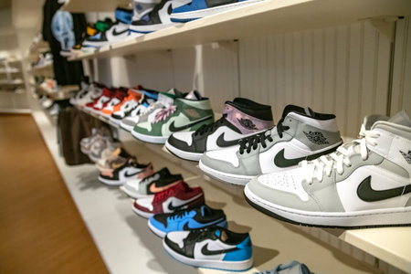 Nike sneakers in a specialty store with a logo.