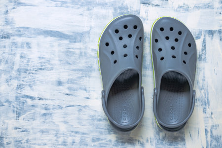 Popular summer flip-flops Crocs. Top view, Space for text.のeditorial素材