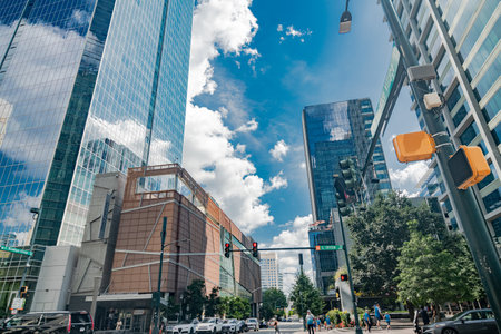 Charlotte Business Center. High-rise buildings, glass facades of buildings reflecting clouds.