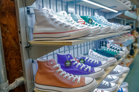 Converse sneakers on the counter of a specialty store in Leesburg. Sale of sports shoes.のeditorial素材