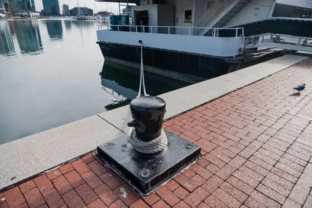 Mooring bollard with rope and moored vesselの写真素材