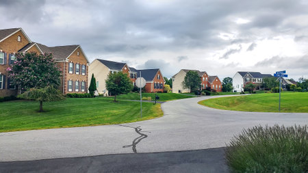 Neighborhood detached homes with garages. Modern single family homes.の写真素材