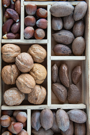 group of different nuts as a background in a box