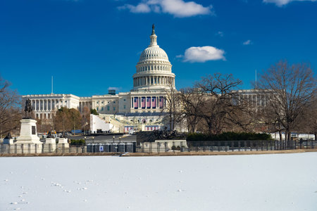 Frozen pond in front of the Capitol building in Washington DC in winter. Cityscape with blue sky.のeditorial素材