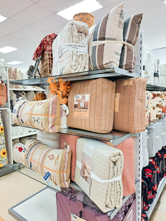 Layout of blankets and throws on racks for sale and display in a supermarket.のeditorial素材