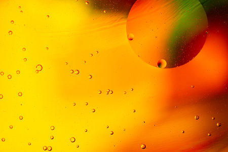 Multicolored patterns of oil on water. Futuristic background for scientific materials.