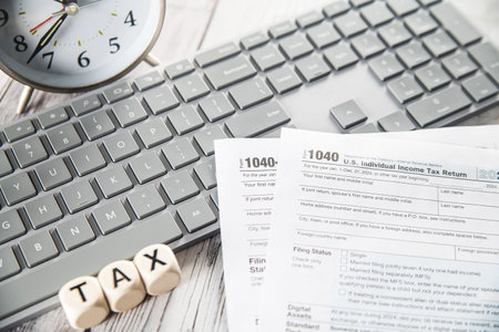 Calculator and computer on the table. Tax deduction planning concept.