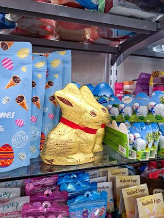 Store shelves with goods for easter. easter bunnies, eggs and other sweetsのeditorial素材