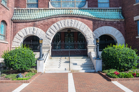 Gate made of metal rods in an arch of a stone wall.のeditorial素材