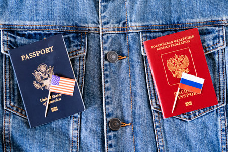 Restoration of US and Russian ambassadorial relations. Two passports, two flags - Russian and American on the background of jeans.の写真素材