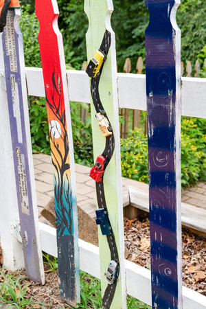 wooden fence decorated with roads and cars.