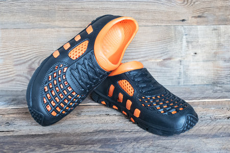 Close up of waterproof rubber walking shoes