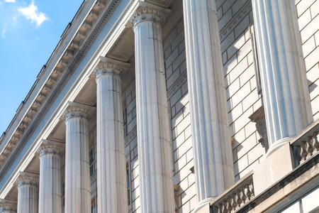 Symmetrical white monumental columns on the facade of the building.の写真素材