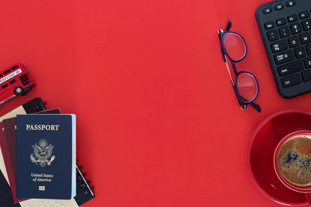 Tourist gear ready for the next journey. Flat lay travel concept with red tones and essentials.