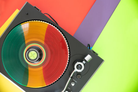 Rainbow vinyl record on vinyl record player.