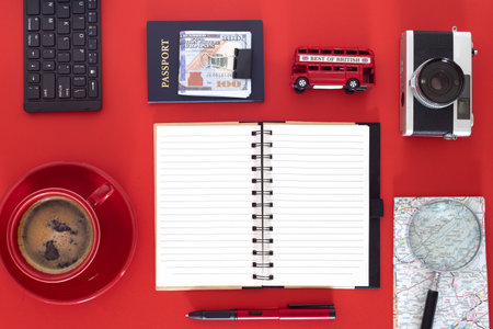 Vacation preparation workspace with stylish travel items. Top view of map, money, and retro...