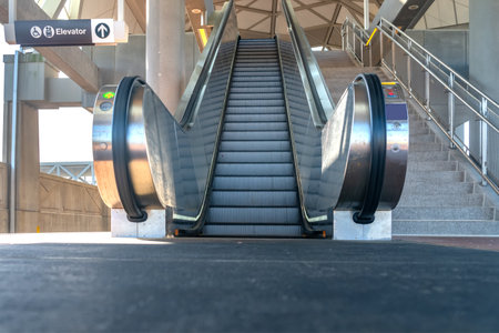Escalator close-up at an elevated subway station. Shooting from a low angle.