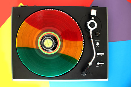Top view of a record player. Rainbow vinyl record on the player.の写真素材
