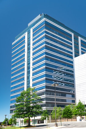 Modern business buildings in the city of Tysons in Virginia. Sunny day, blue sky.