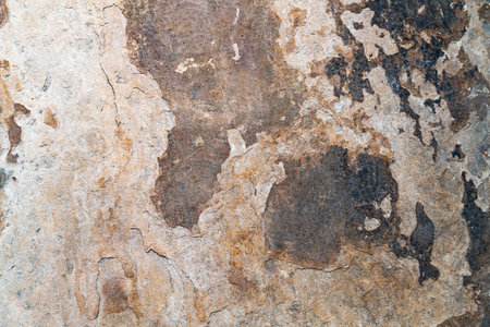 Abstract background of aged, corroded stone. Industrial decay with rustic detail and texture.