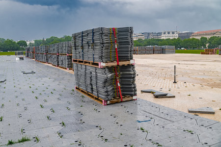 Pallets with Protective plastic tiles to protect grass during mass events