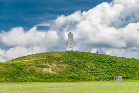 Wright Brothers National Monument, NC, on a green hill under the clouds.の写真素材