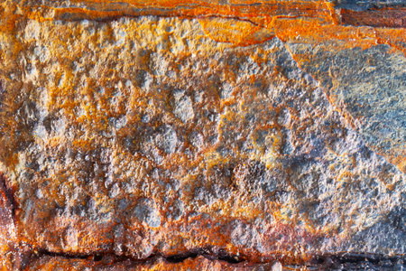 Close-up of rusted metal. Strong rust texture with flakes and cracks.