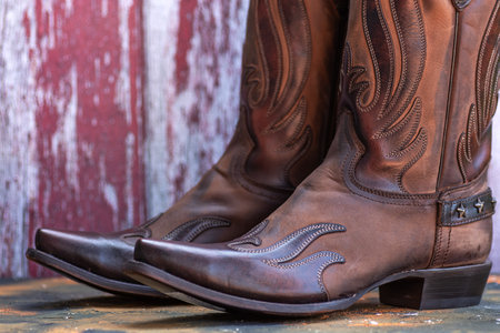 Pair of handmade cowboy boots. Leather footwear in western style.の写真素材