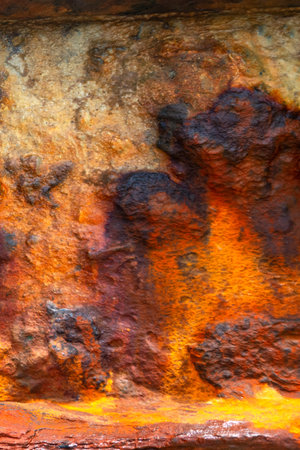 Textured corrosion. Worn iron with patina.