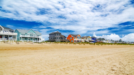 Rows of beach houses on stilts on the Atlantic Ocean beach in North Caraline.の写真素材