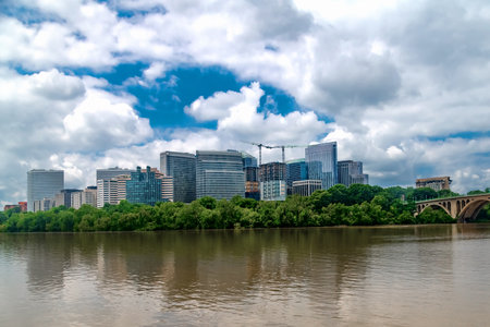 Urban Waterfront Development in Arlington, Virginia Modern skyline across the Potomac River with ongoing construction and glass towers.の写真素材