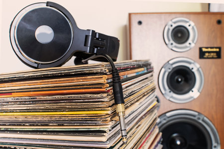 Analog Sound Vibes â€“ DJ Headphones and Stacked LPs in Studio Light
