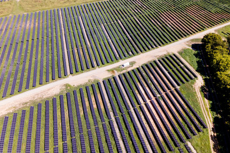 Vast solar energy field supplies electricity to growing suburban neighborhood.