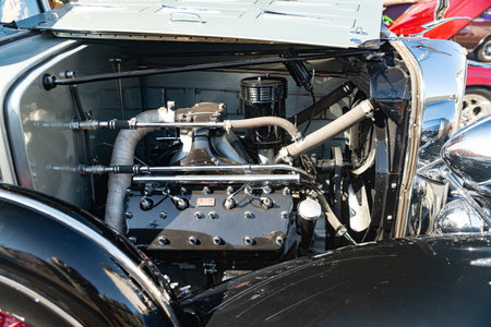 Mechanical power and retro design in the engine bay of a restored car.