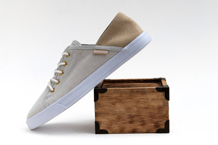 Fashionable Tommy Hilfiger casual sneakers with flat white laces, detailed seams, and gum-colored...